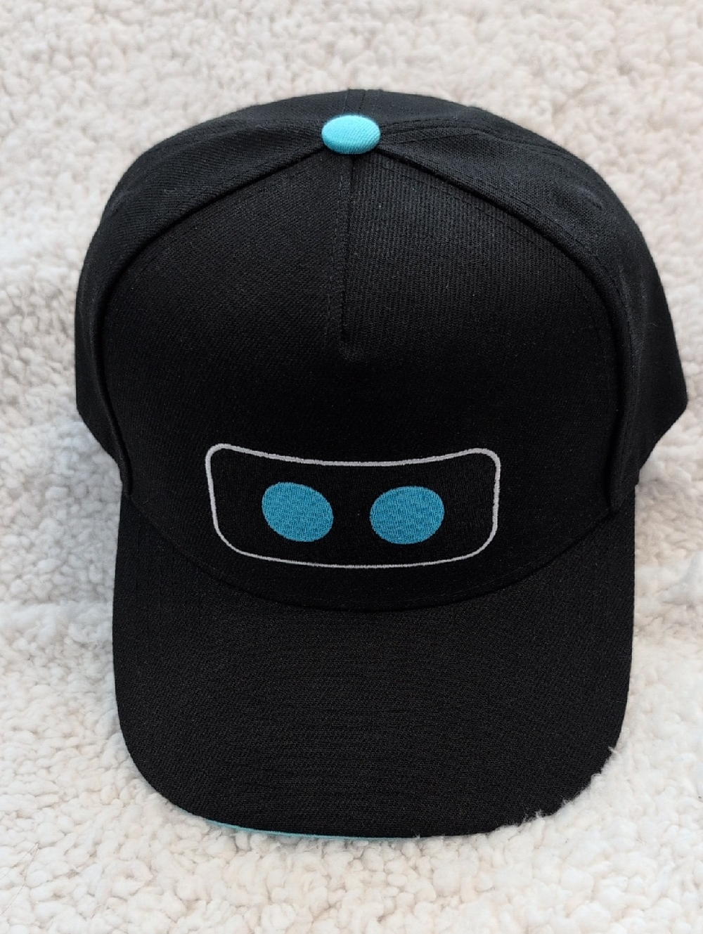 Astro Bot Black Baseball Cap with Teal Accent